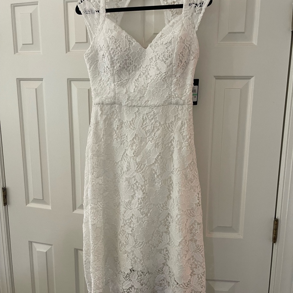 Beautiful white lace midi dresses by Guess. NWT. 2 sizes available (8, 14)